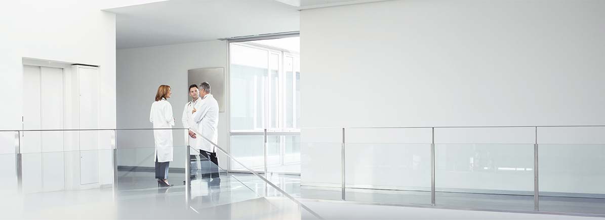 Physicians standing in hallway