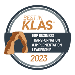 A circle logo that says Best in KLAS (trademark) - ERP Business Transformation and Implementation Leadership 2023, with a drawing of a natural brown stone archway.