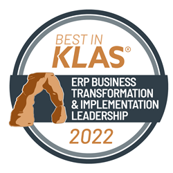 Here you go: A circle logo that says Best in Klas (trademark) - ERP Business Transformation and Implementation Leadership 2022, with a drawing of a natural brown stone archway.