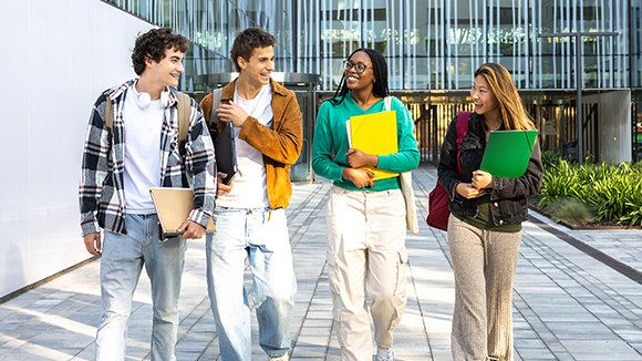 A group of college kids walking on campus